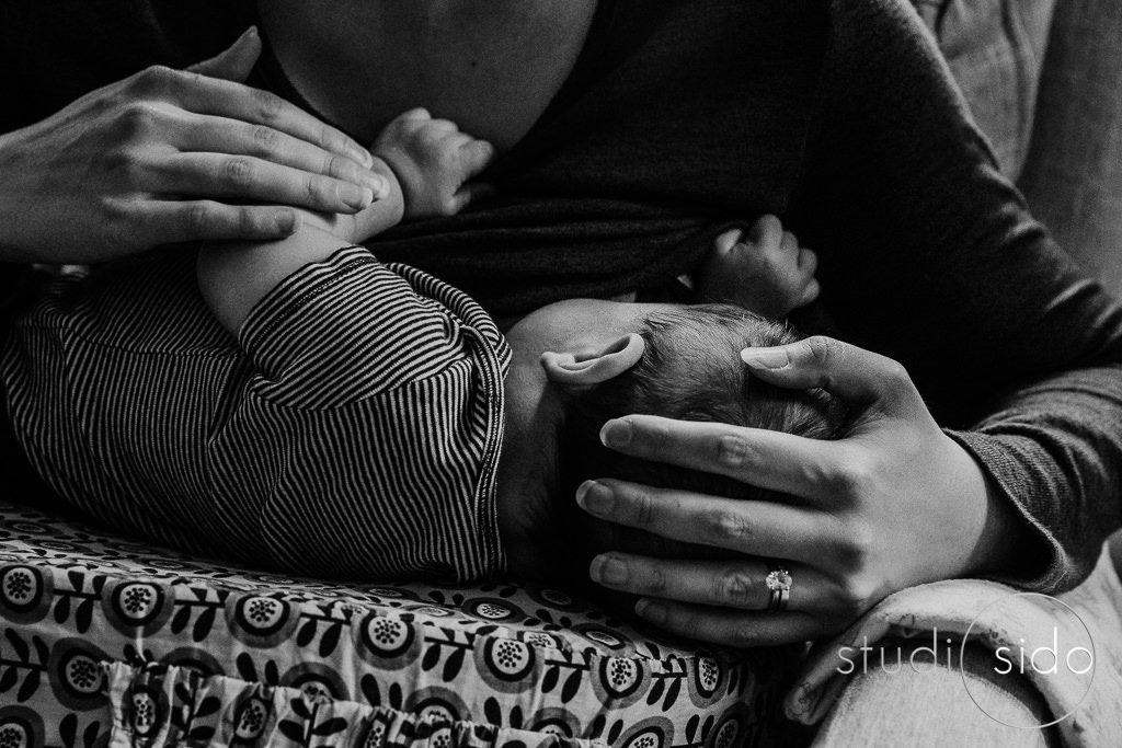 Black and white photo of mom nursing baby, Los Angeles, CA