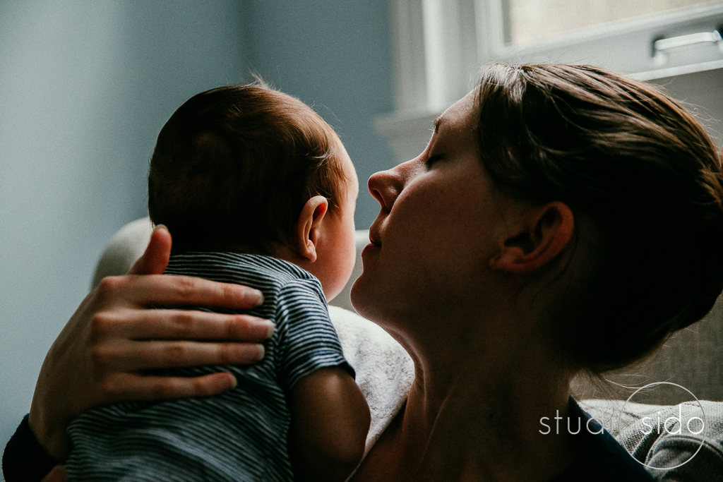 mama burping baby, Los Angeles, CA