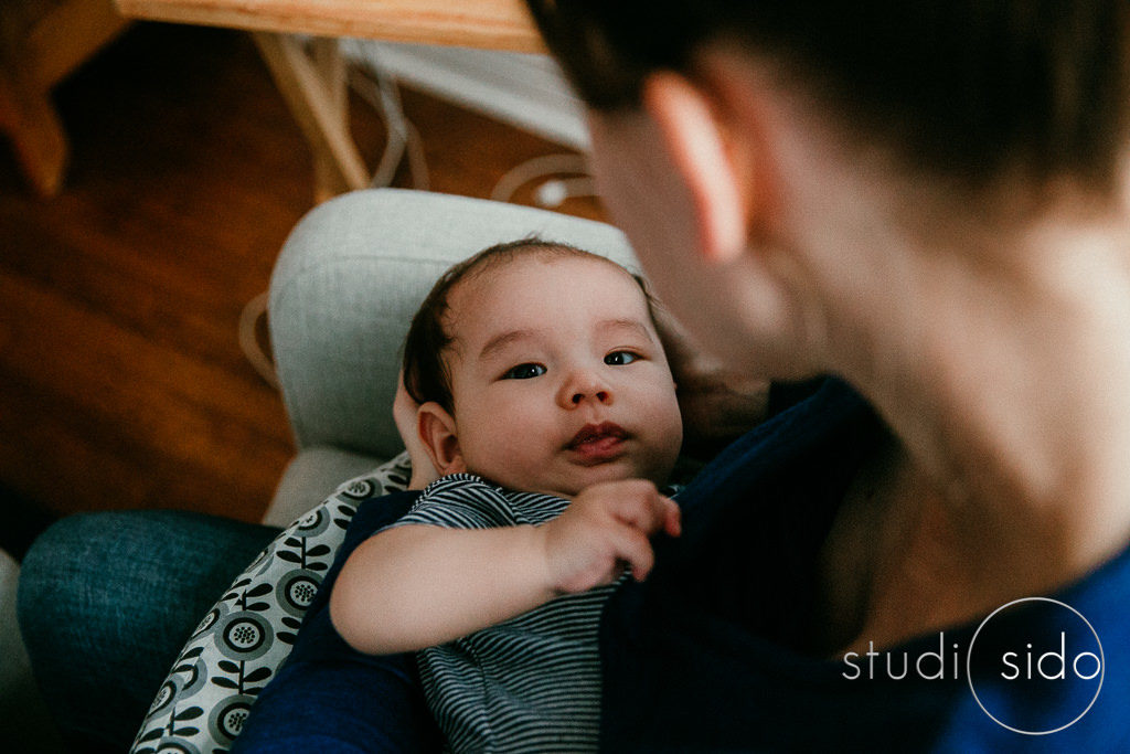 Baby looking at camera after nursing, Los Angeles, CA