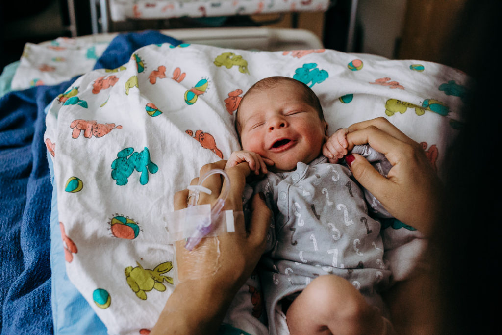 Smiling newborn baby at Kaiser Hospital in Hollywood, CA