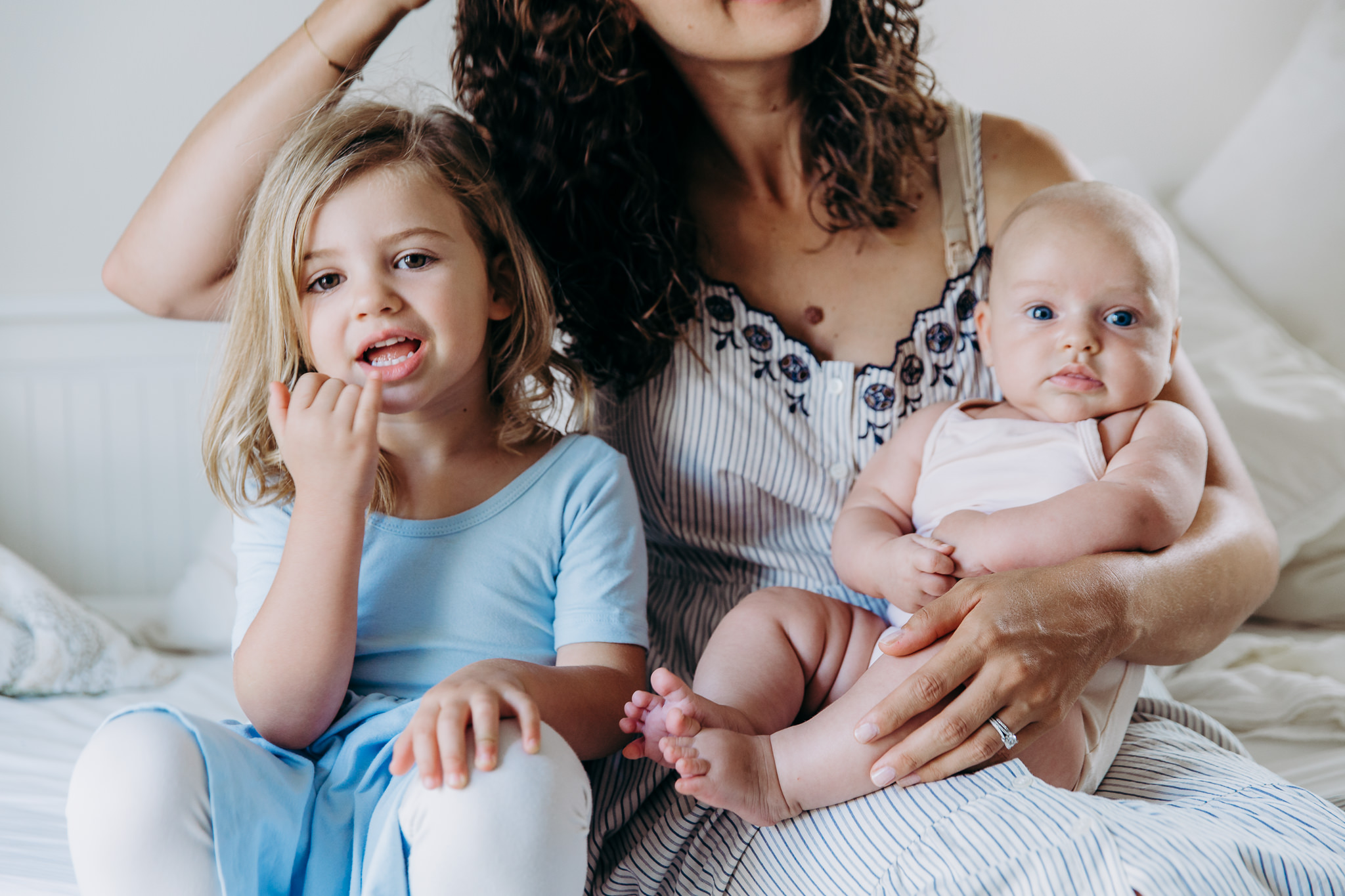 Family photo - mama sitting with her young daughter and holding her baby in Atwater Village, CA