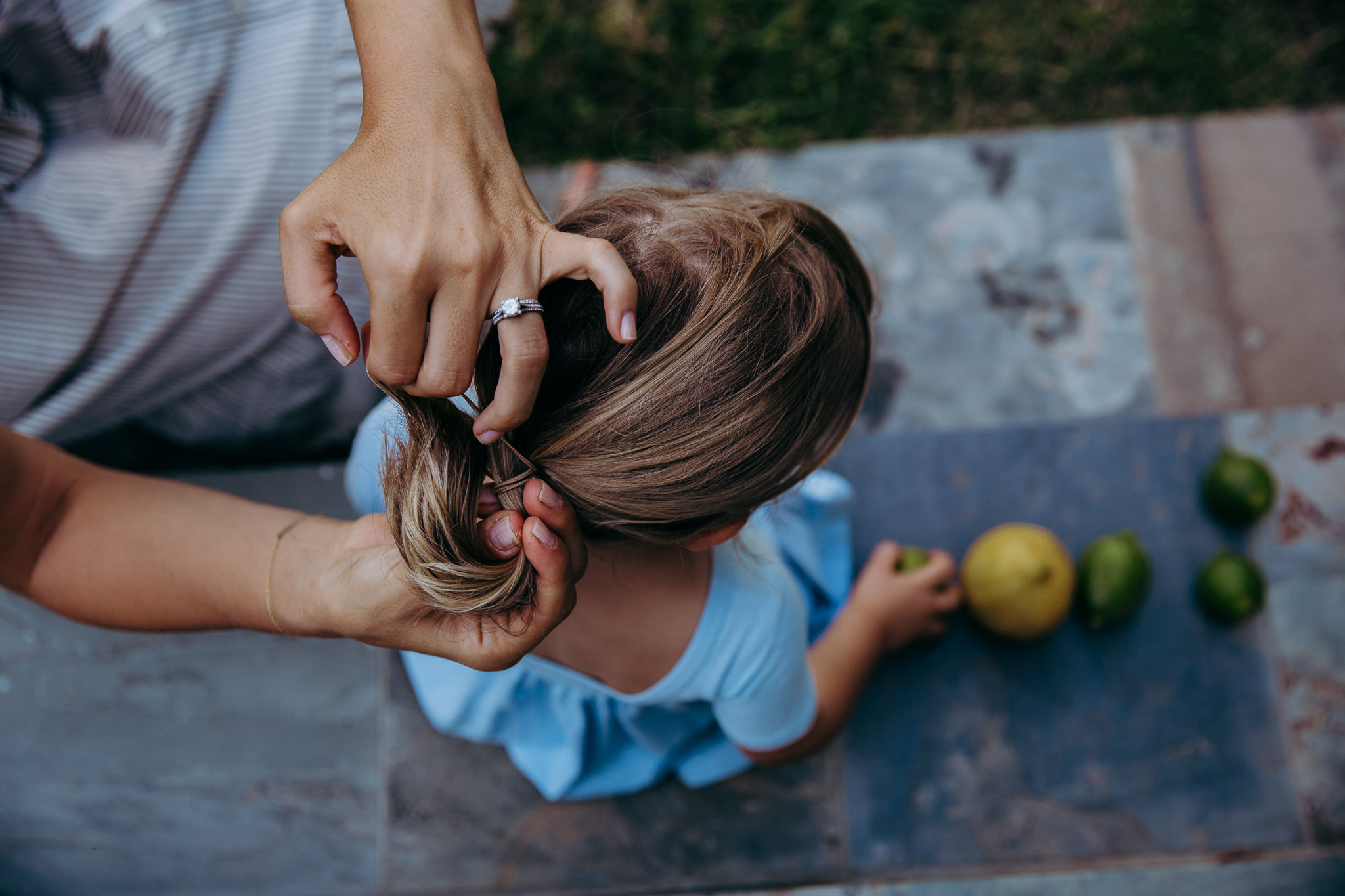 mom puts daughter's hair in ponytail - Atwater Village, CA