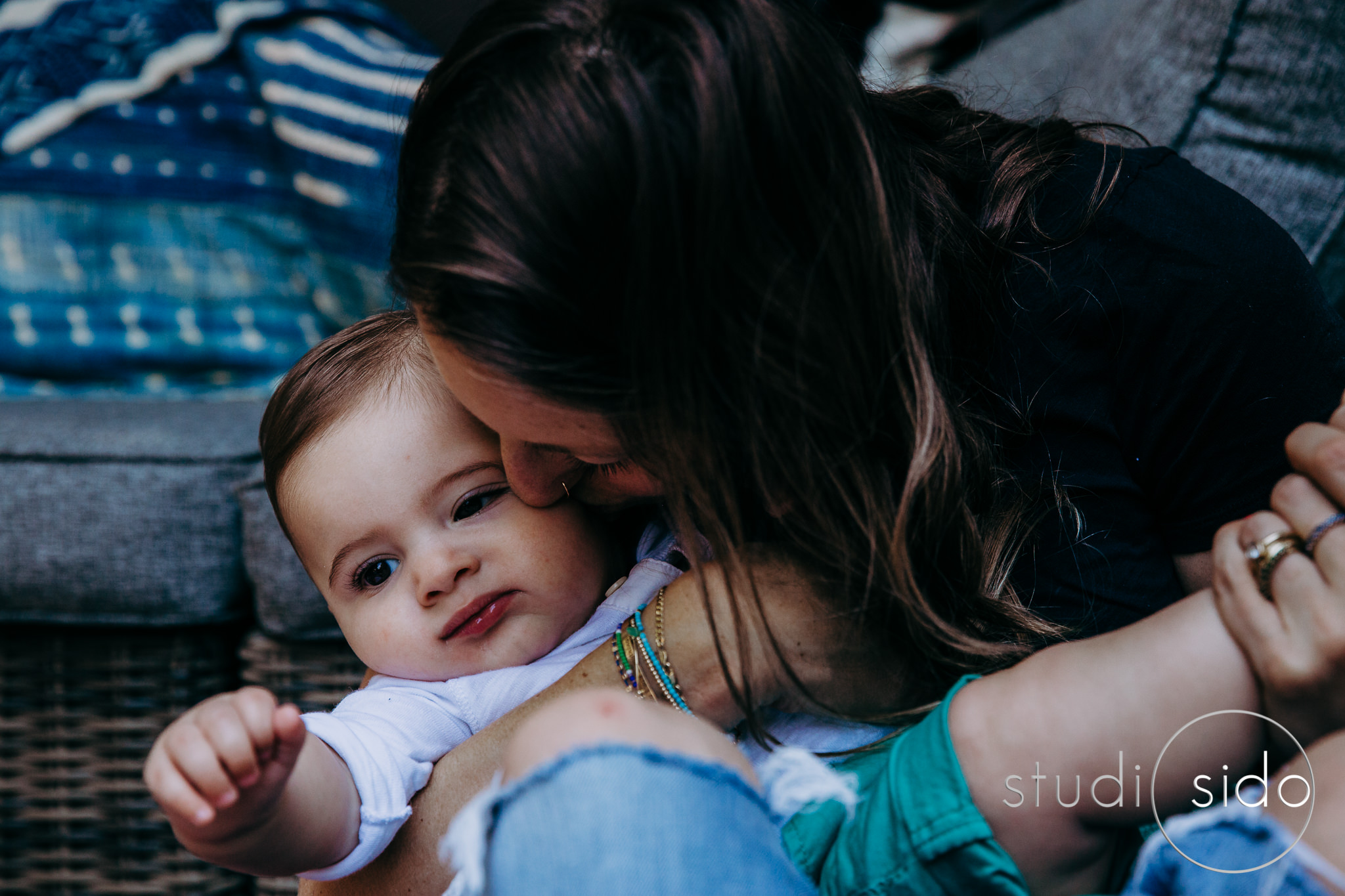 mom kissing baby