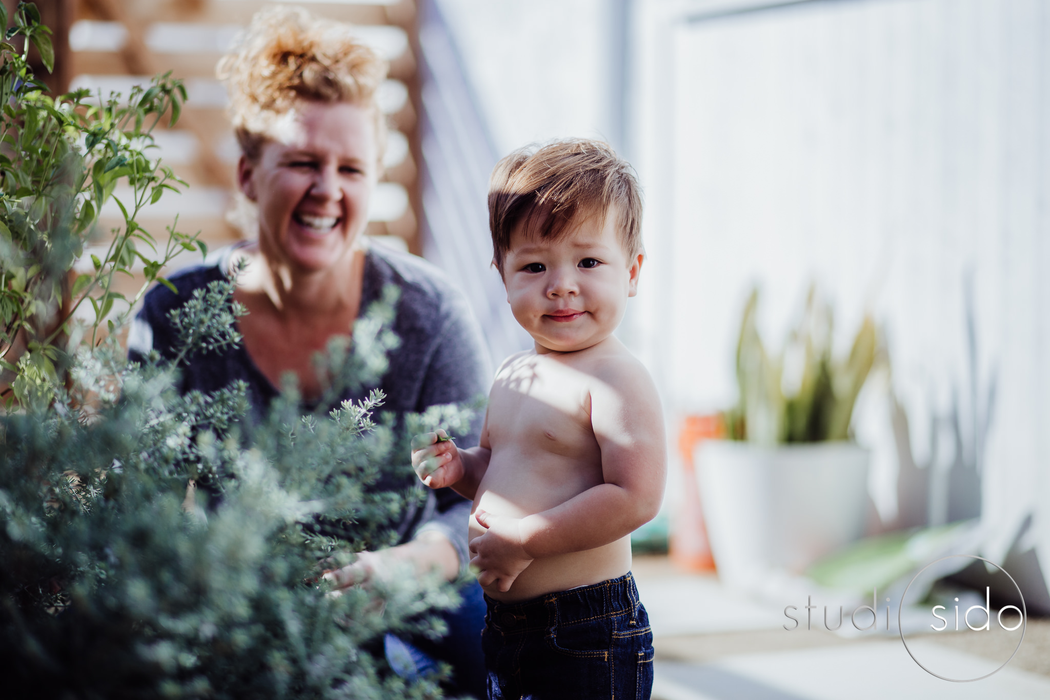 Mom and toddler son in the garden in Los Angeles, CA