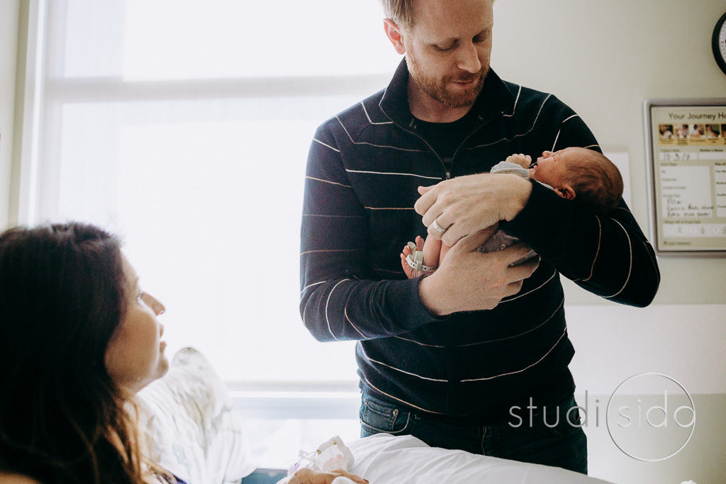 Dad holds newborn baby boy in Hollywood, CA