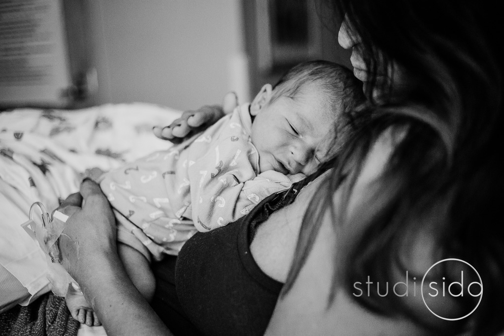 Newborn sleeps on his mother's chest