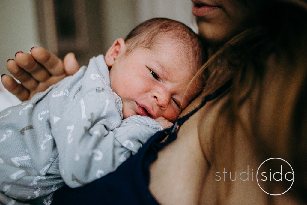 Newborn baby on his mother's chest