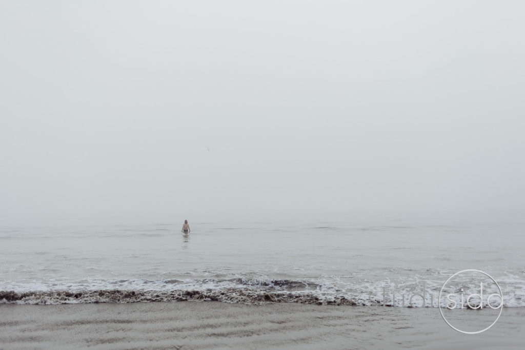 A woman walks into the Pacific Ocean in Santa Monica, California.