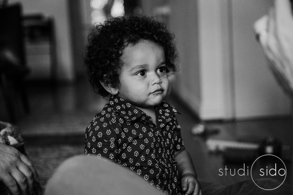 A B&W photograph of a boy looking serious.