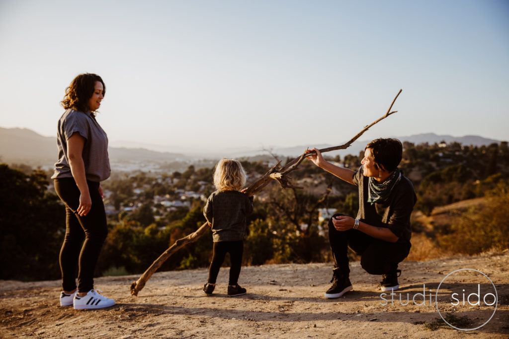 Two moms and their son on a mountain in Los Angeles, CA