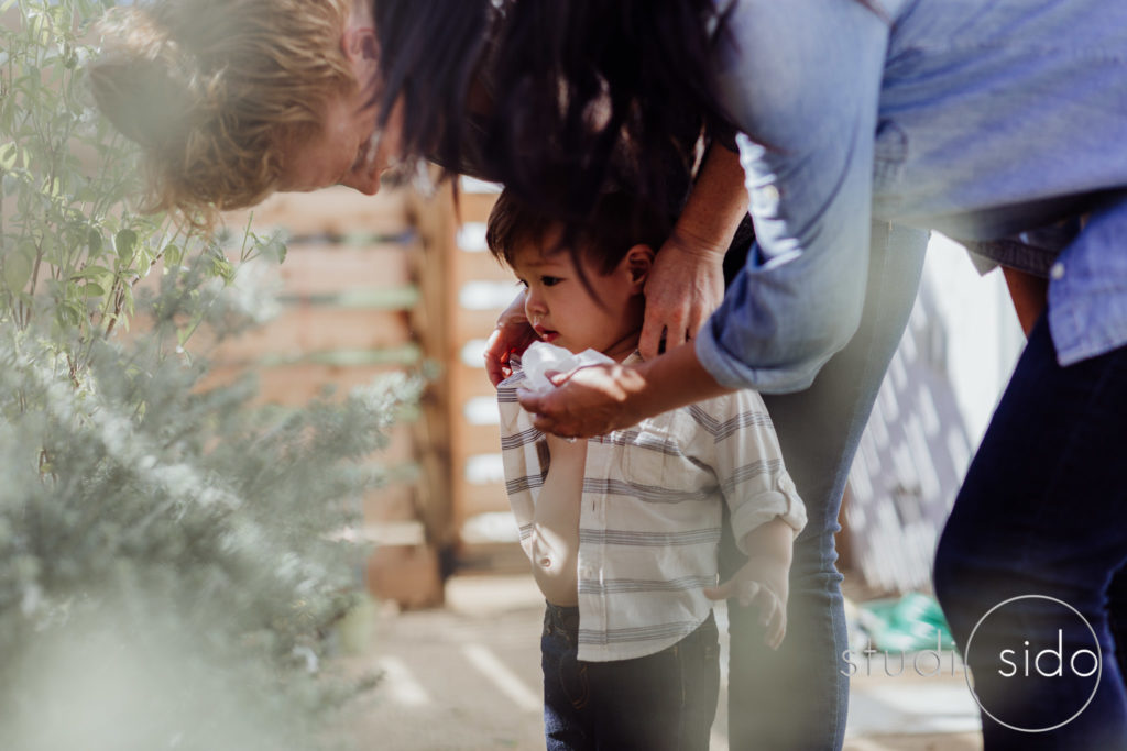 Moms with their toddler in their garden