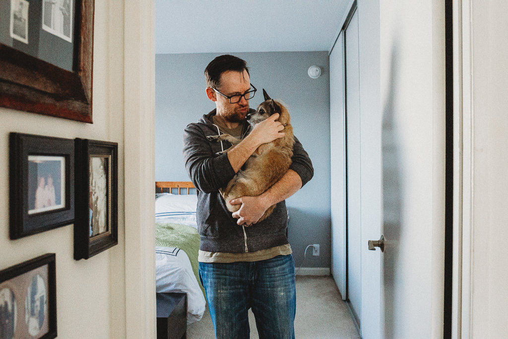 Man holds his dog