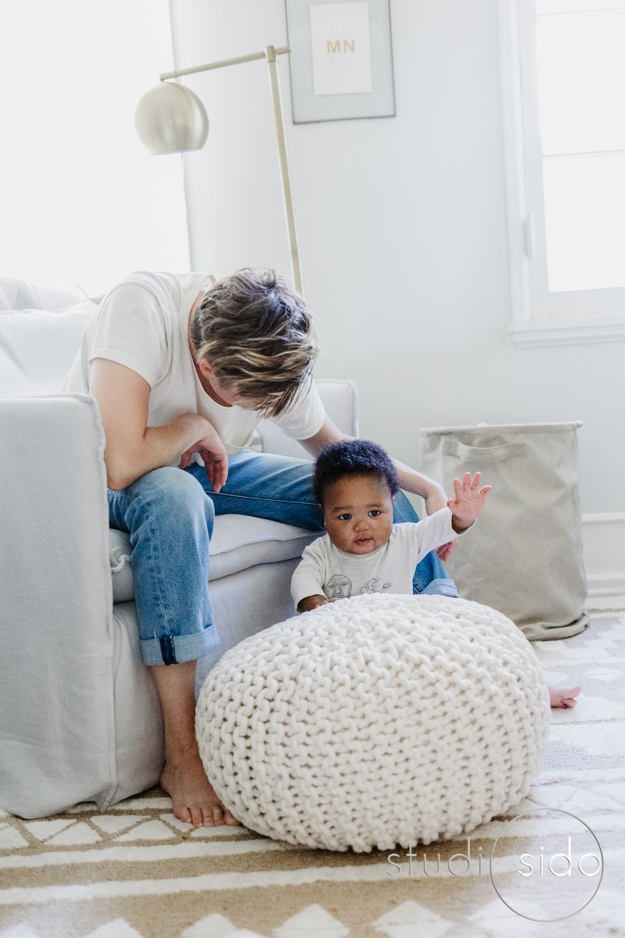 Little boy with his mom in his nursery in LA, CA