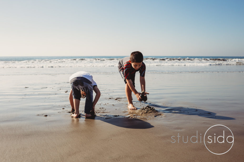 Two Kids Playing on Beach in California