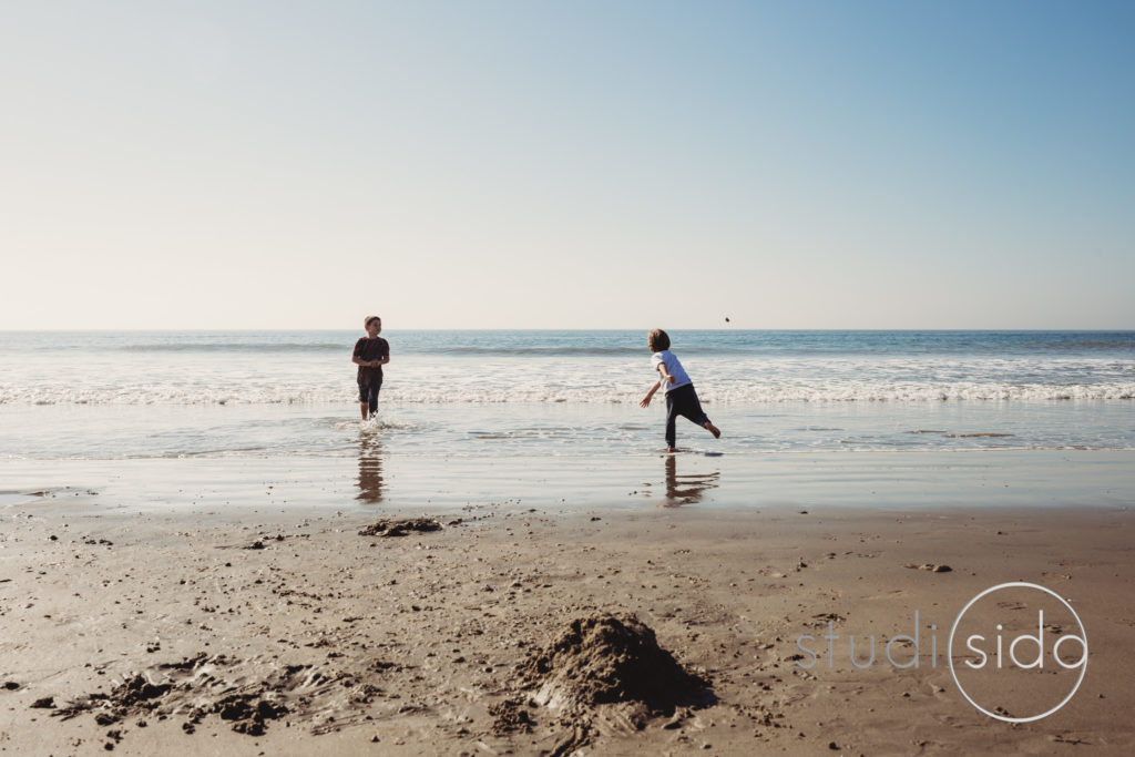 Children in California Playing on Beach