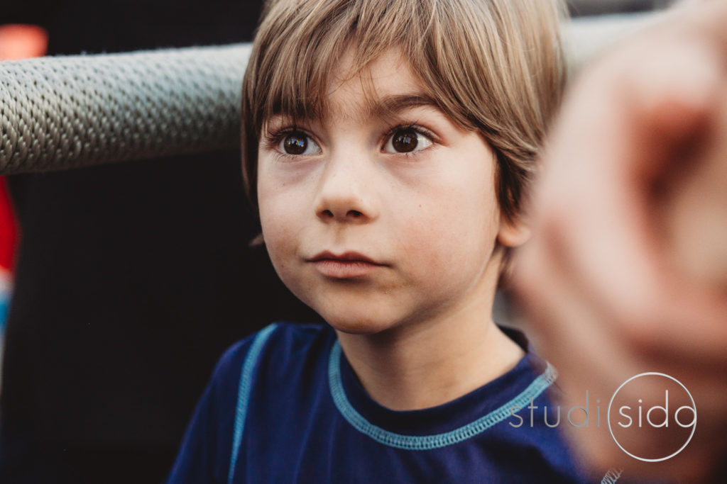 Young Boy With Brown Eyes Looking Into The Distance