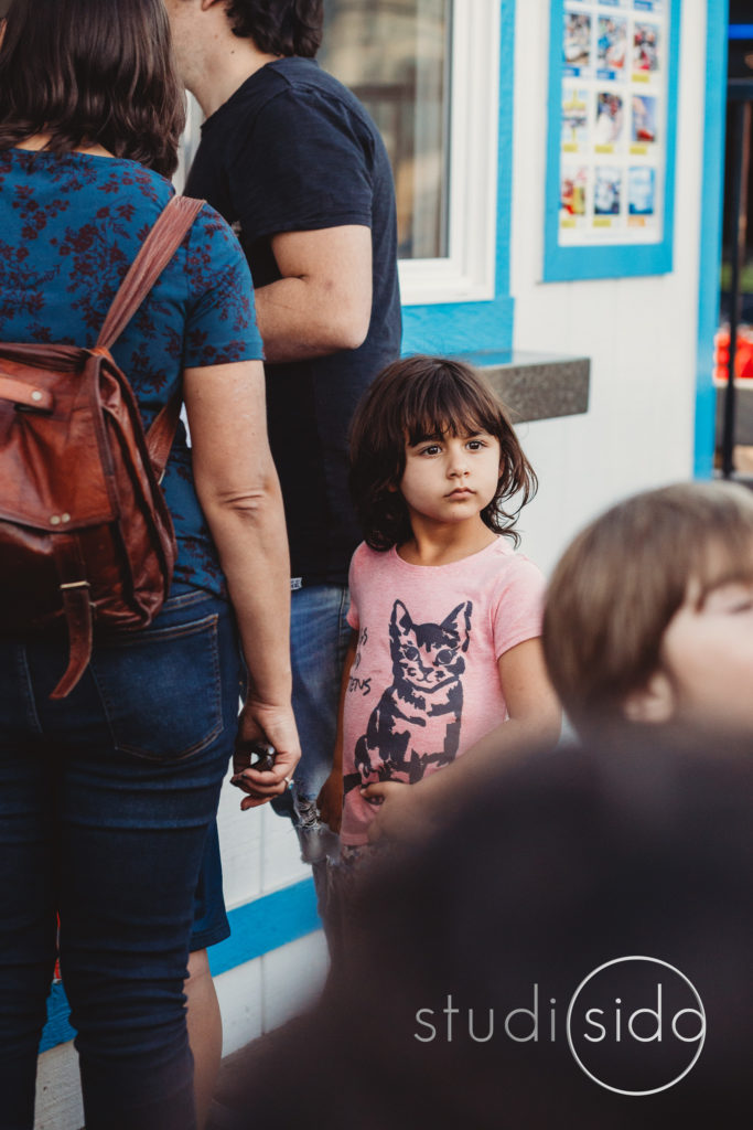 Young Child in Crowd Looking Into Distance