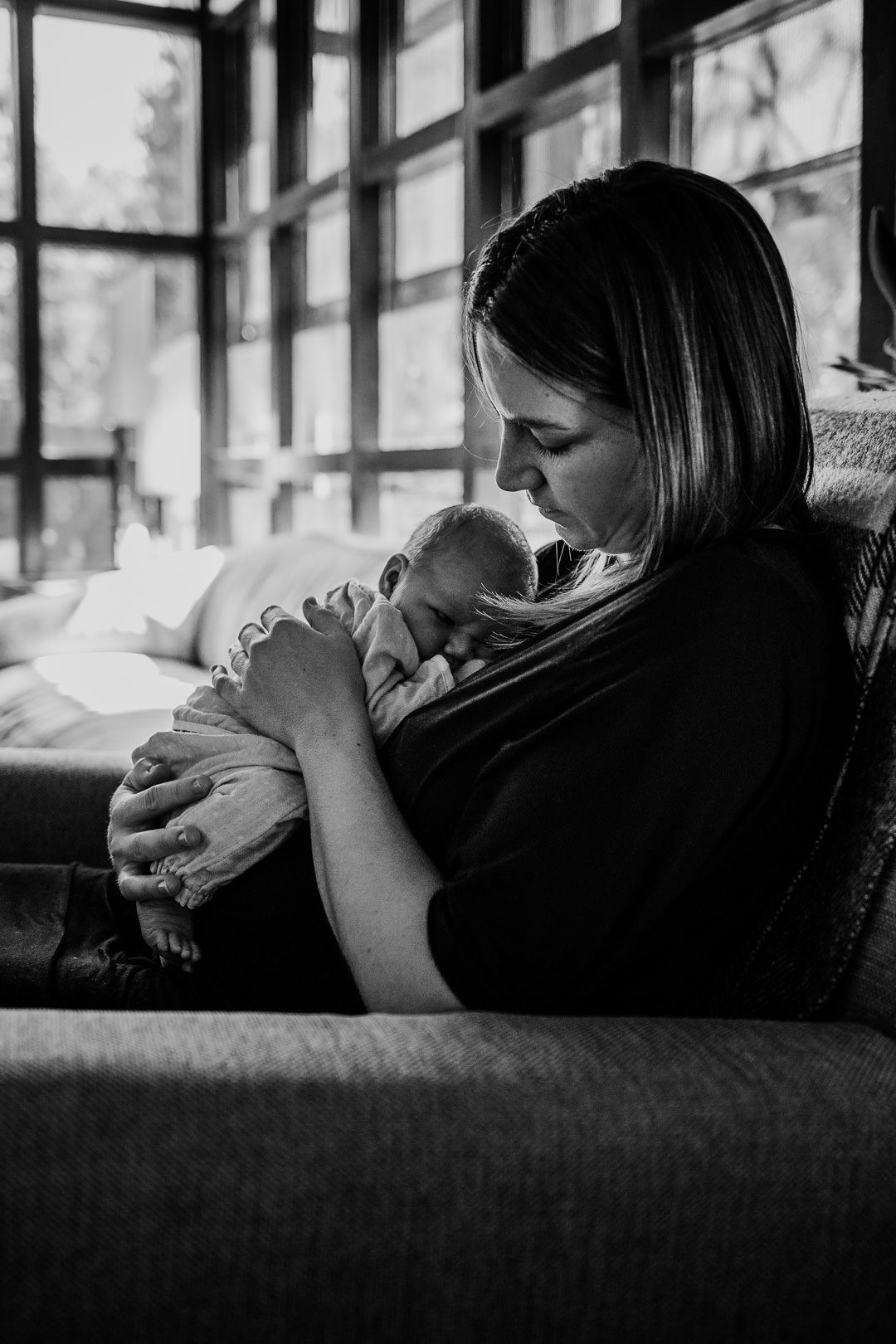 Nom Holding Newborn Baby Black and White Photo