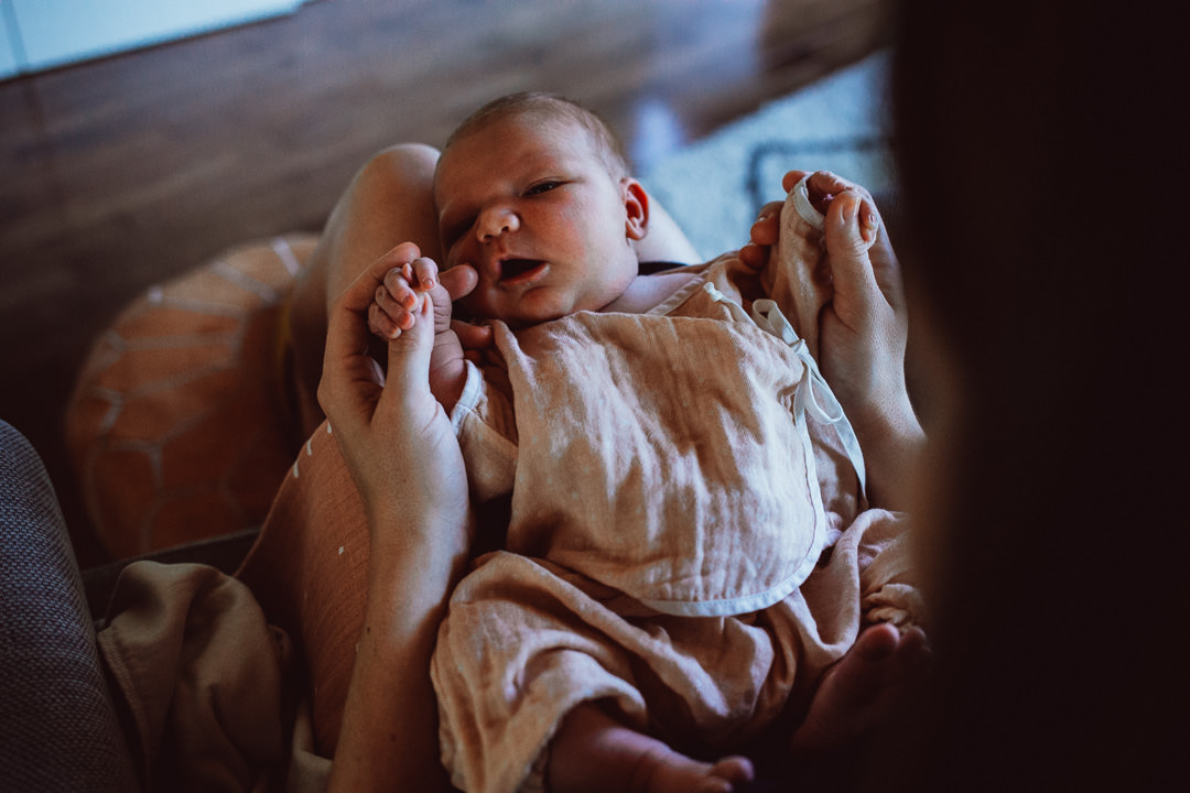 Newborn Baby With Burp Cloth On Lap