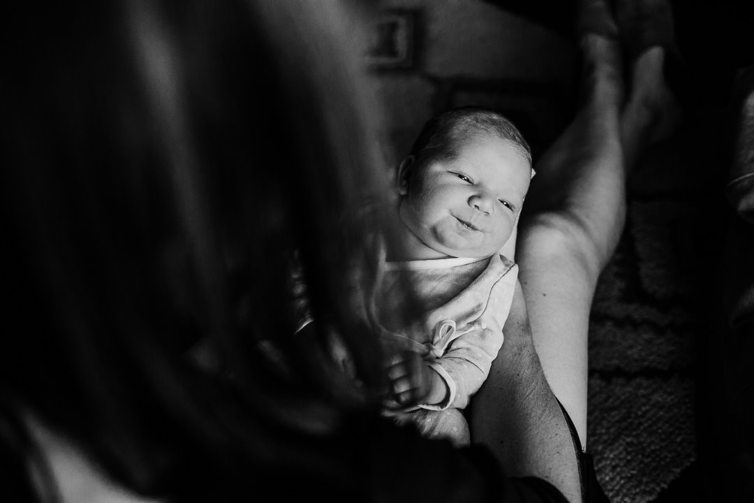 Black and white photograph of newborn baby in mom's lap in Mount Washington, Los Angeles, CA