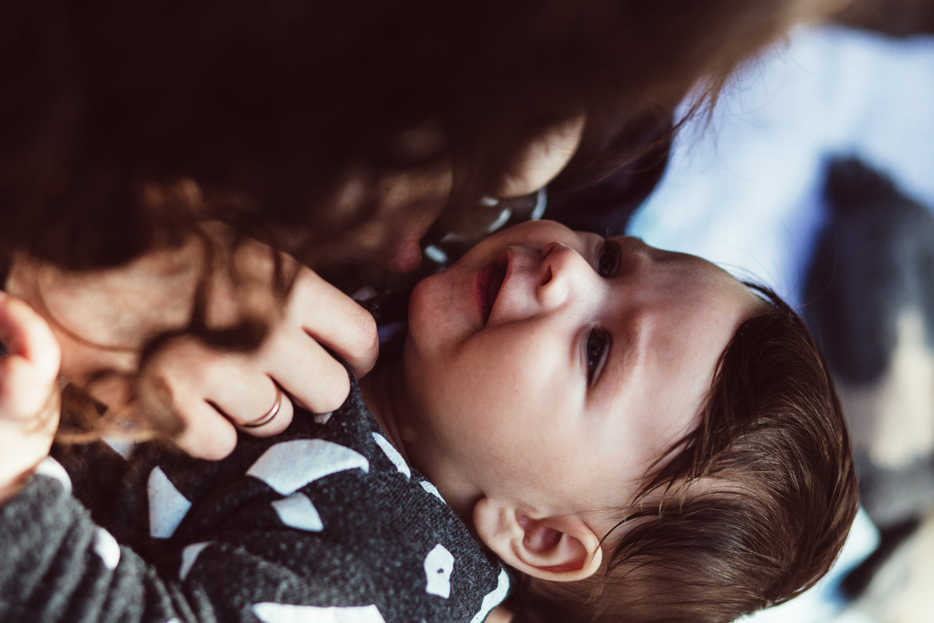 Baby Smiling Up At Parent