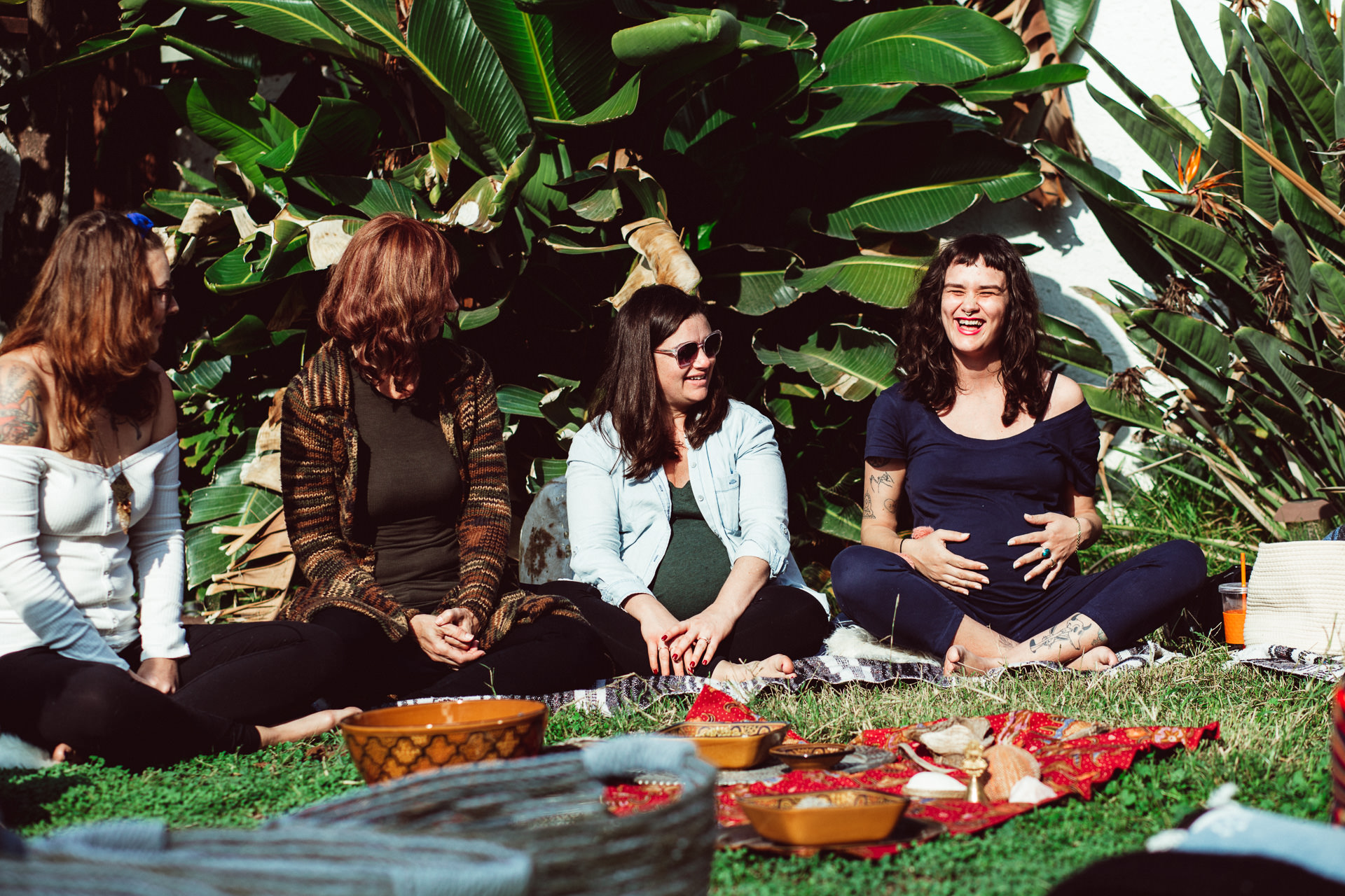 Pregnant Women Sitting Around in Circle Outside