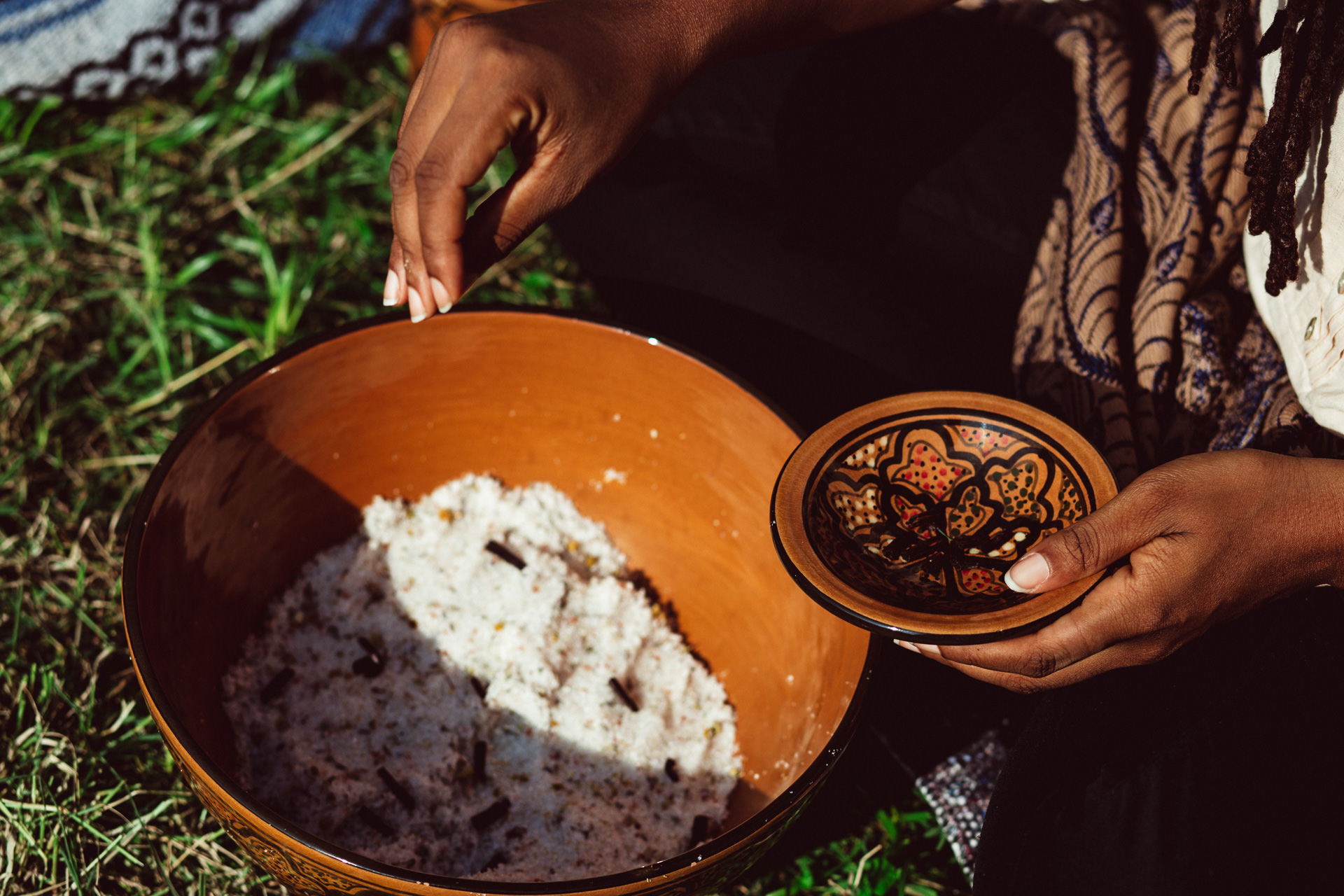 Woman Holding Bowls Outside in Grass