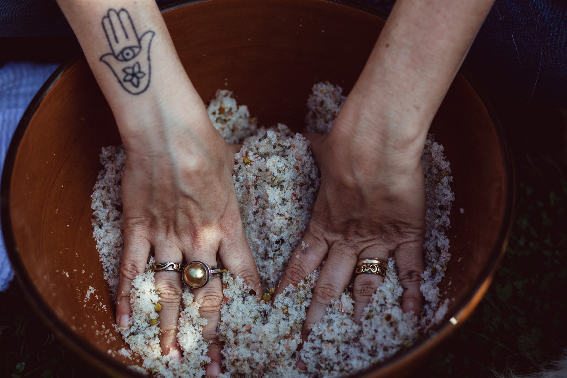 Woman's Hands in Wooden Salt Bowl