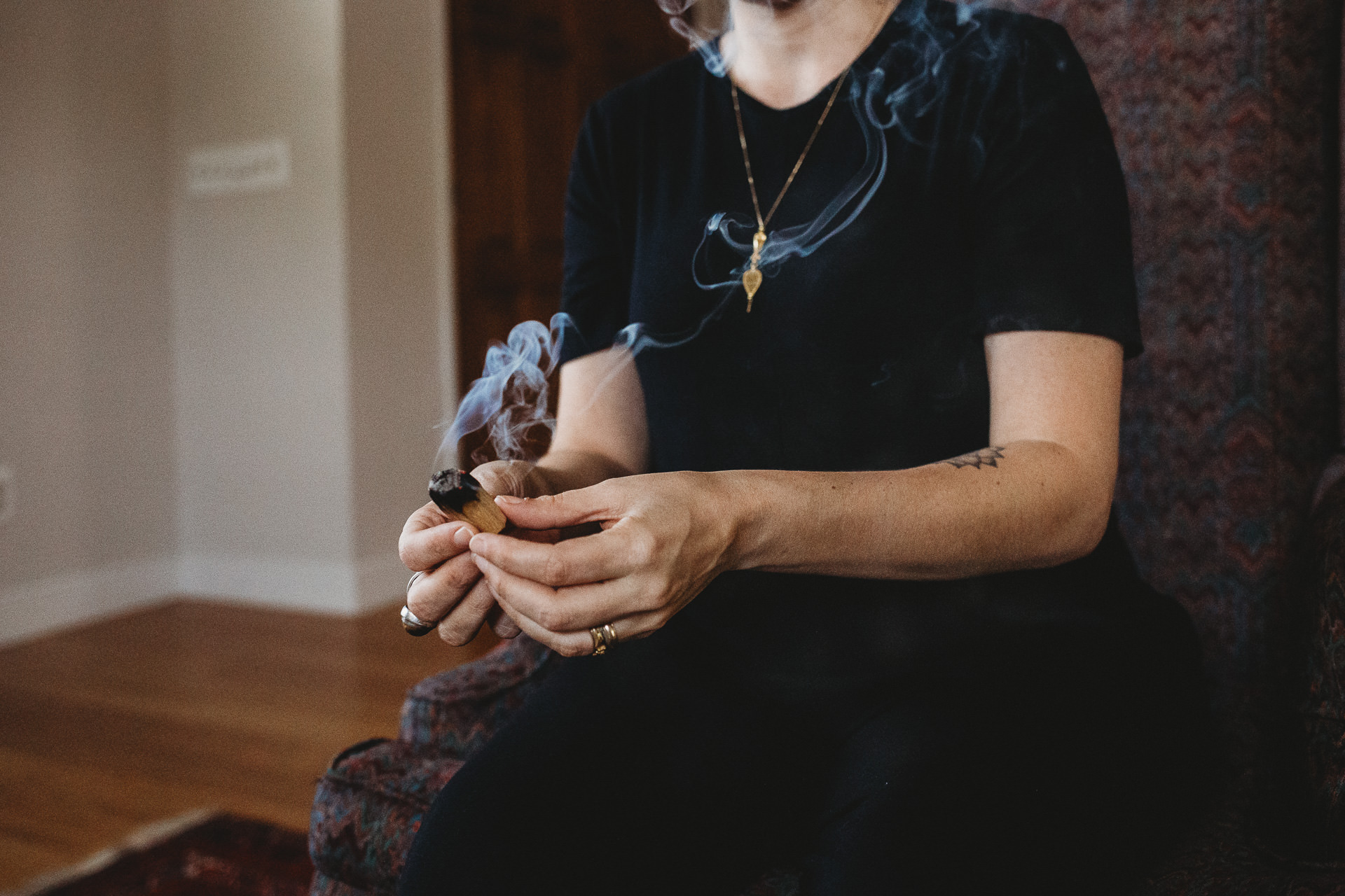 Woman Holding Burning Incense Stick Inside