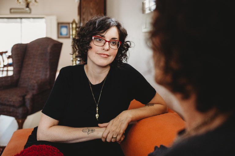 Branding photograph of parenting/birth coach Becca Gordon as she listens to a client