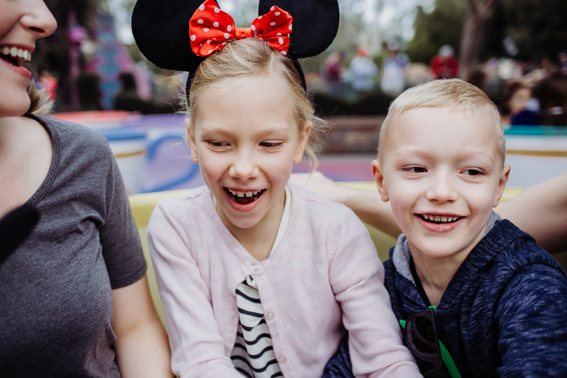 A family rides the teacups at Disneyland