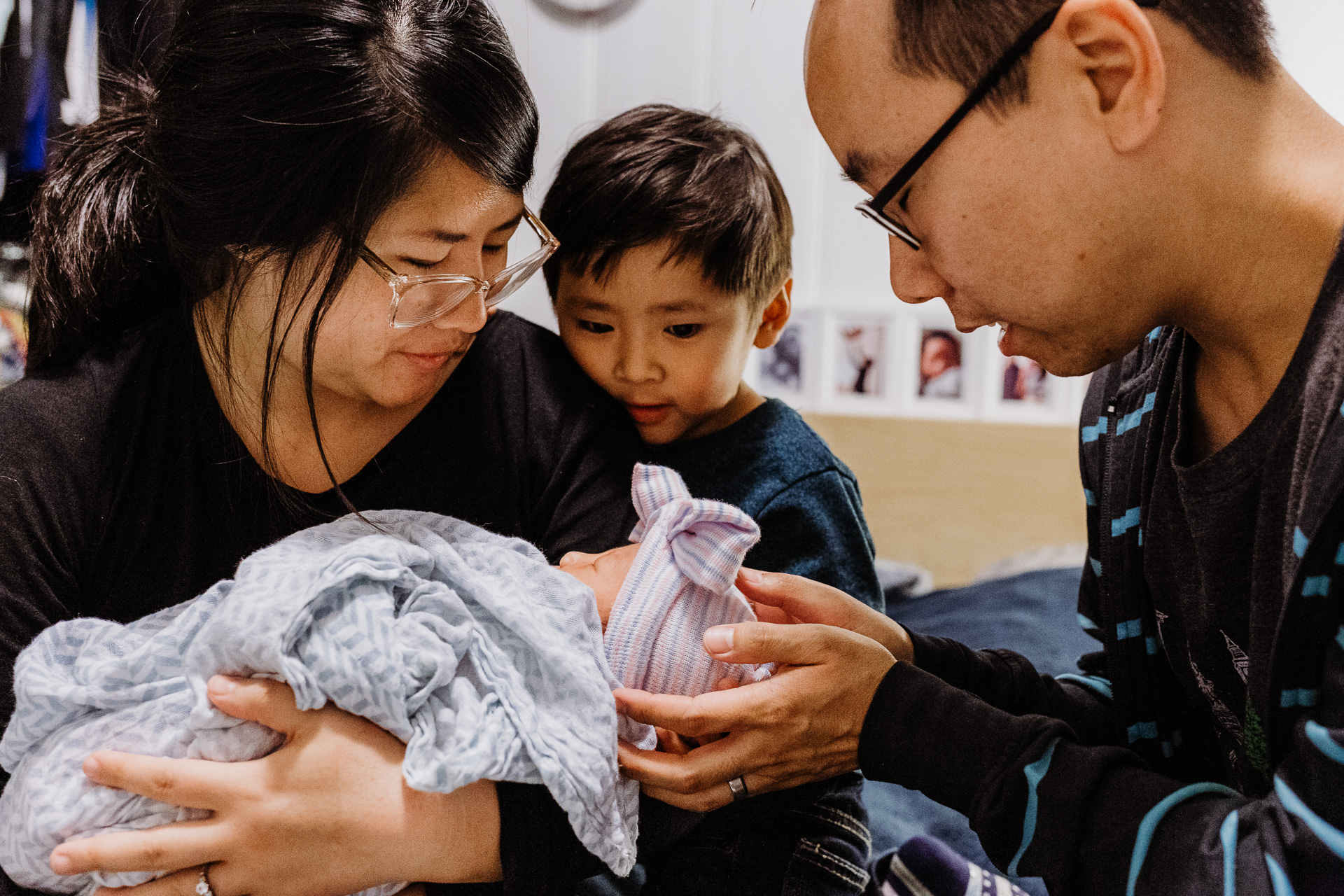 A family prays over their newborn baby girl in Alhambra, CA