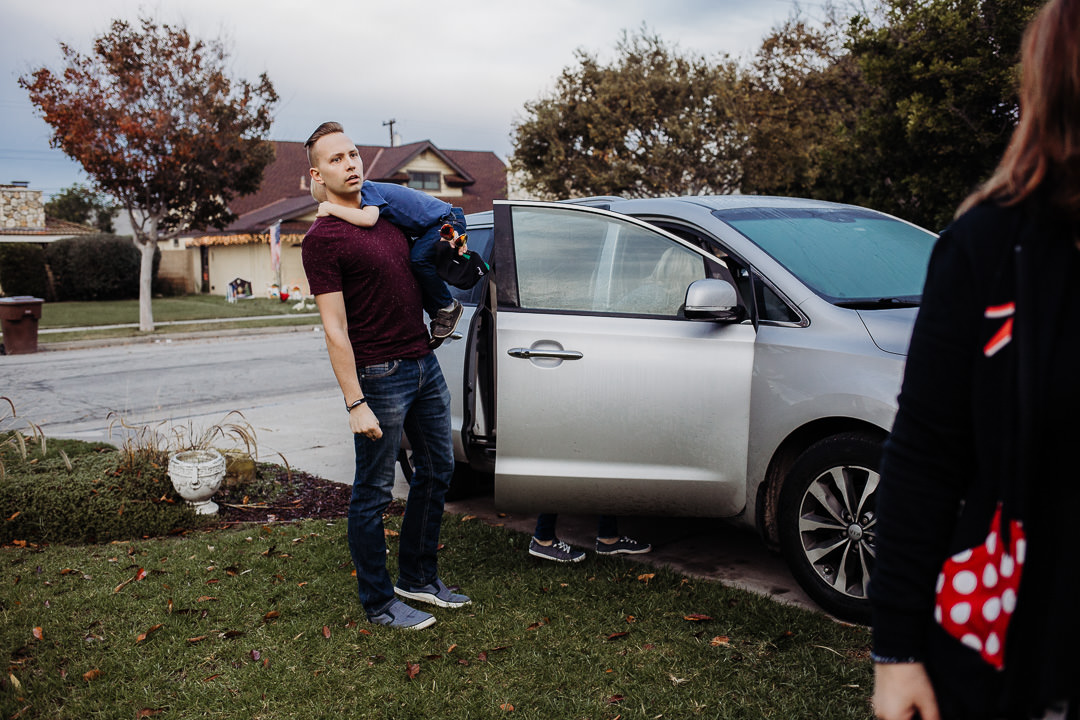 Dad holds his son, about to drive to Disneyland