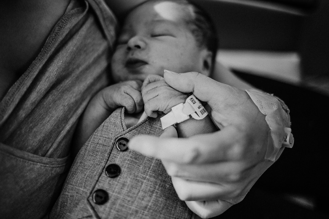 Newborn Baby Wearing Hospital Bracelet in Black and White