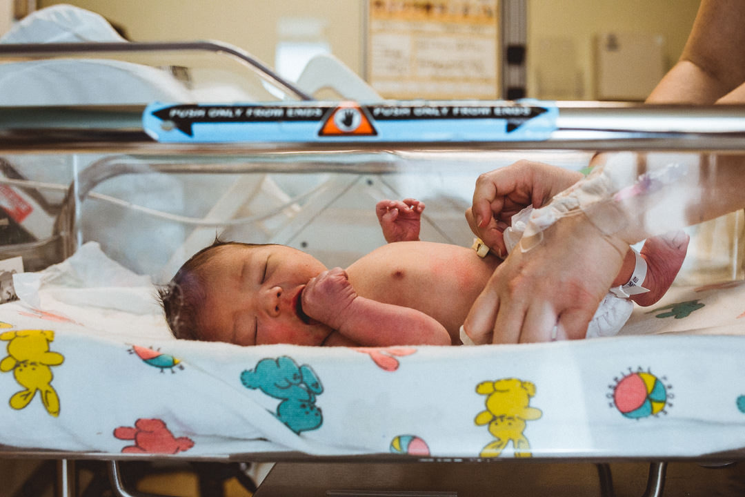 Baby Laying in Hospital Bassinet