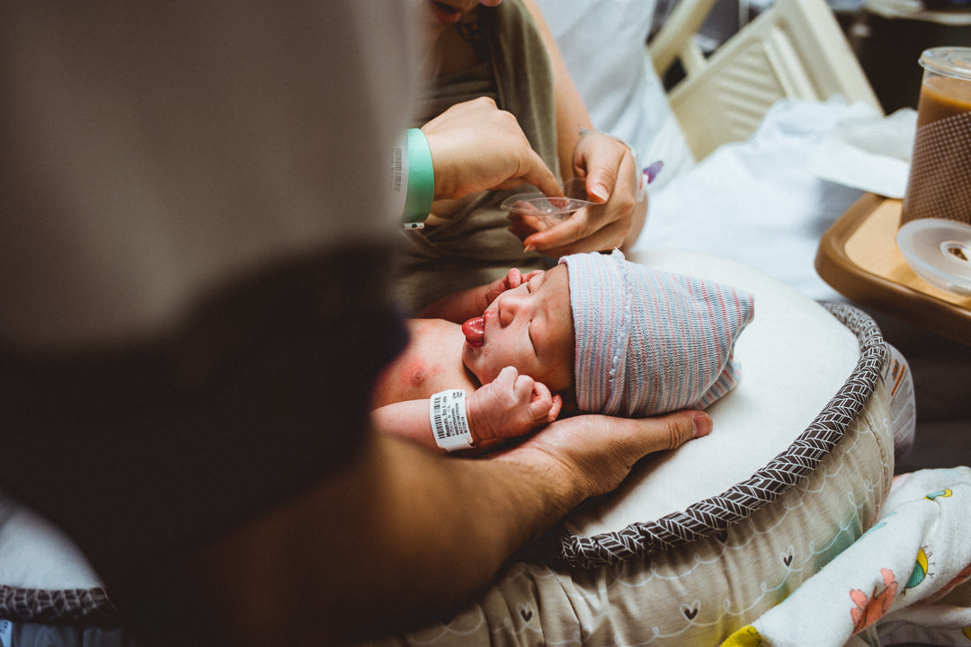 Newborn baby being fed in the hospital