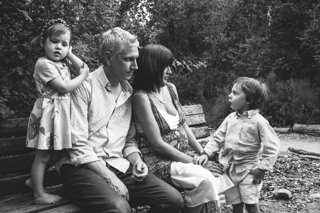 Black and white portrait of a family - a mother, father, daughter, and son - in a park in Pasadena, CA