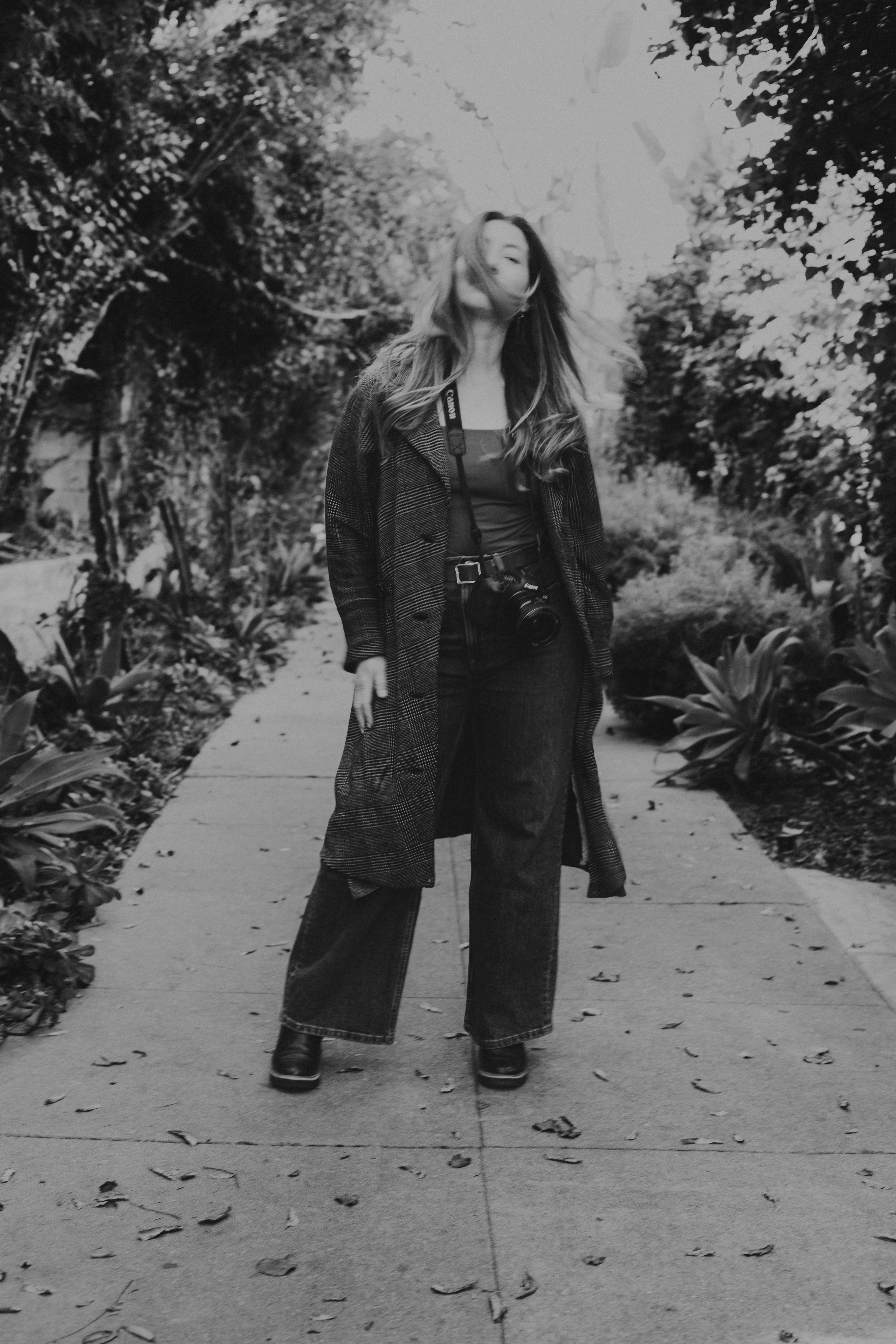 Woman in Long Trench Coat Photo In Black and White