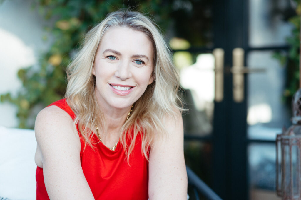 Editorial headshot of woman in a red dress