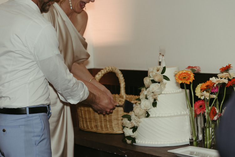 Bride and groom cutting cake